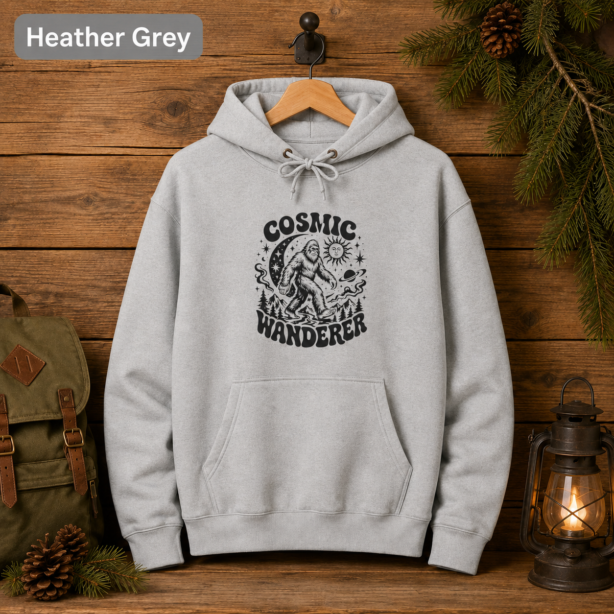 Cosmic Wanderer Sasquatch Hoodie, Retro Celestial Bigfoot Sweatshirt, Outdoorsy Camp Hoodie, Lane Seven Three-Panel Fleece Hoodie